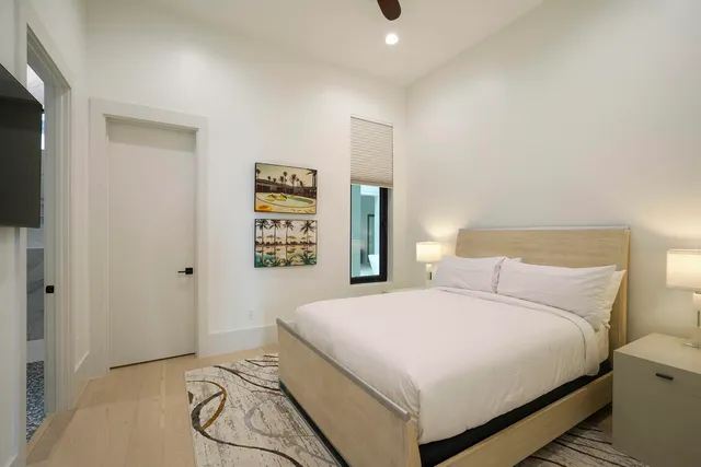 a living room with furniture and large window