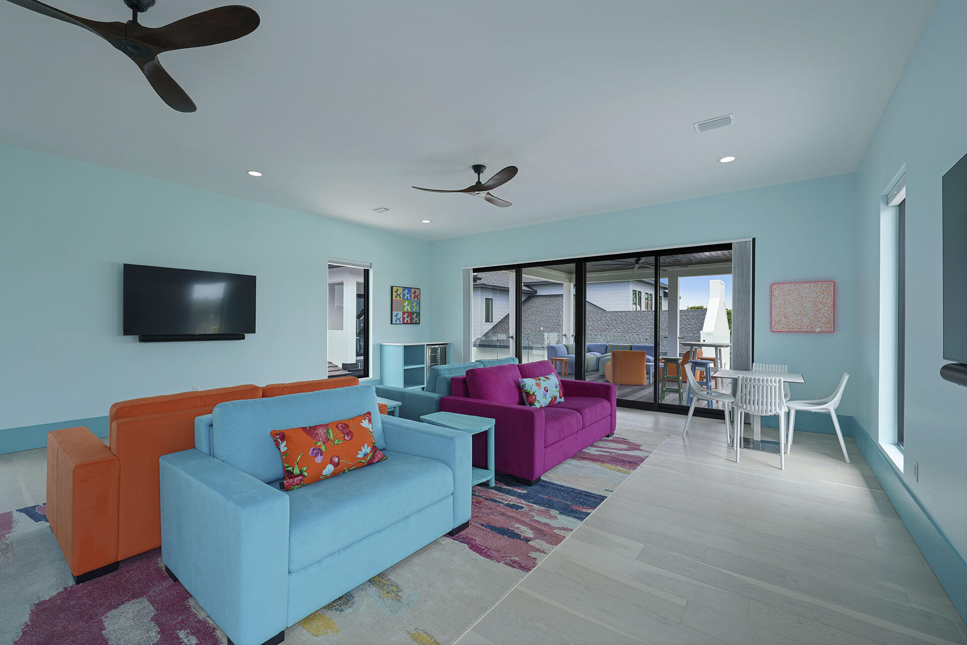 396 Walton Way Miramar Beach, FL 32550 - Photo 59 of 75 a living room with furniture a flat screen tv and a chandelier