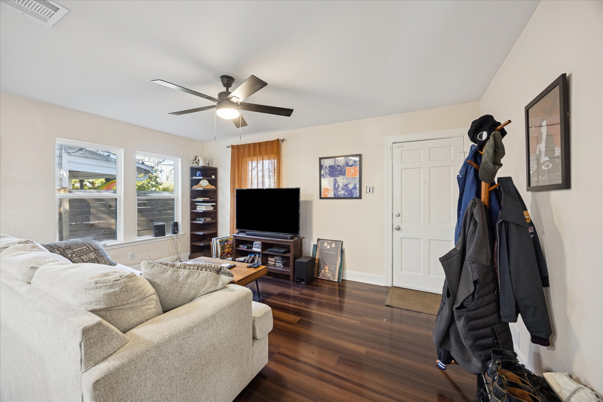 907 East 53rd Street Austin, TX 78751 - Photo 4 of 30 Living area featuring dark wood-style floors and ceiling fan