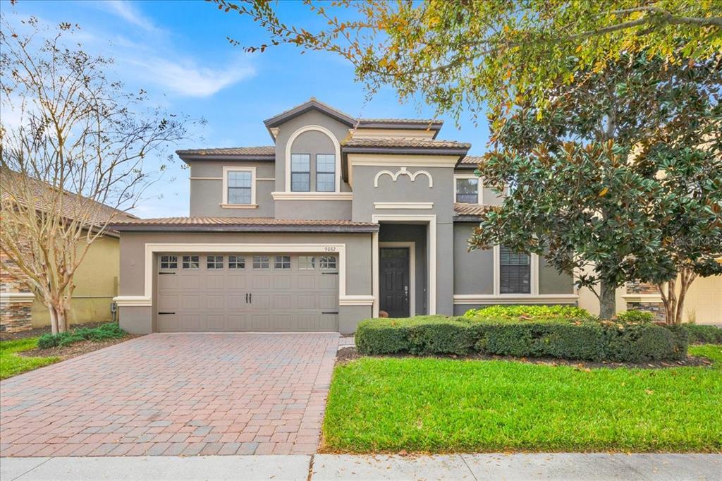 a view of house with yard and entertaining space