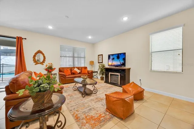 a living room with furniture and a flat screen tv