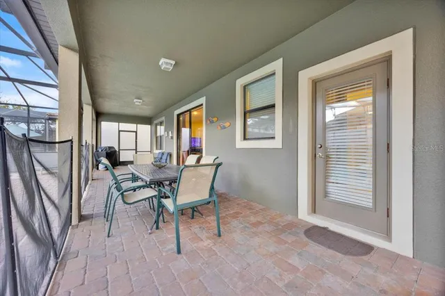 a view of a livingroom with furniture and a window