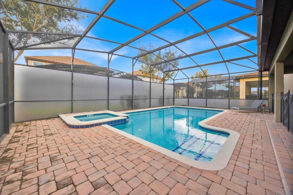 9032 Shadow Mountain Street Davenport, FL 33896 - Photo 34 of 43 a outdoor space with pool and table