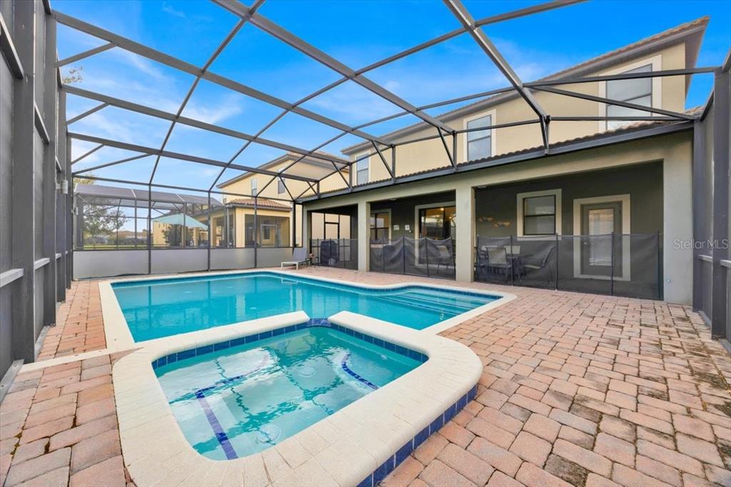 9032 Shadow Mountain Street Davenport, FL 33896 - Photo 35 of 43 a view of swimming pool with a lounge chair