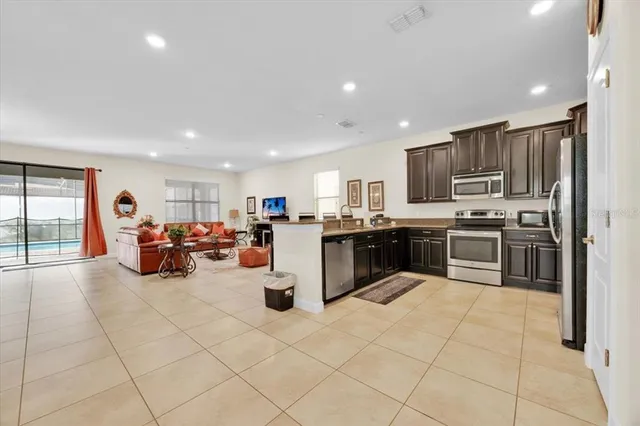a kitchen with stainless steel appliances lots of counter top space