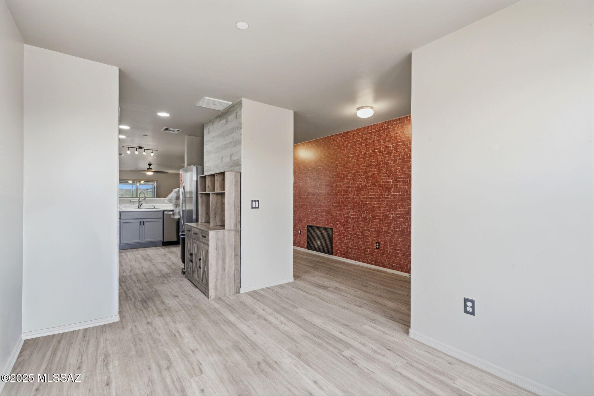 1458 North Wentworth Road Vail, AZ 85641 - Photo 10 of 44 a view of a hallway with wooden floor