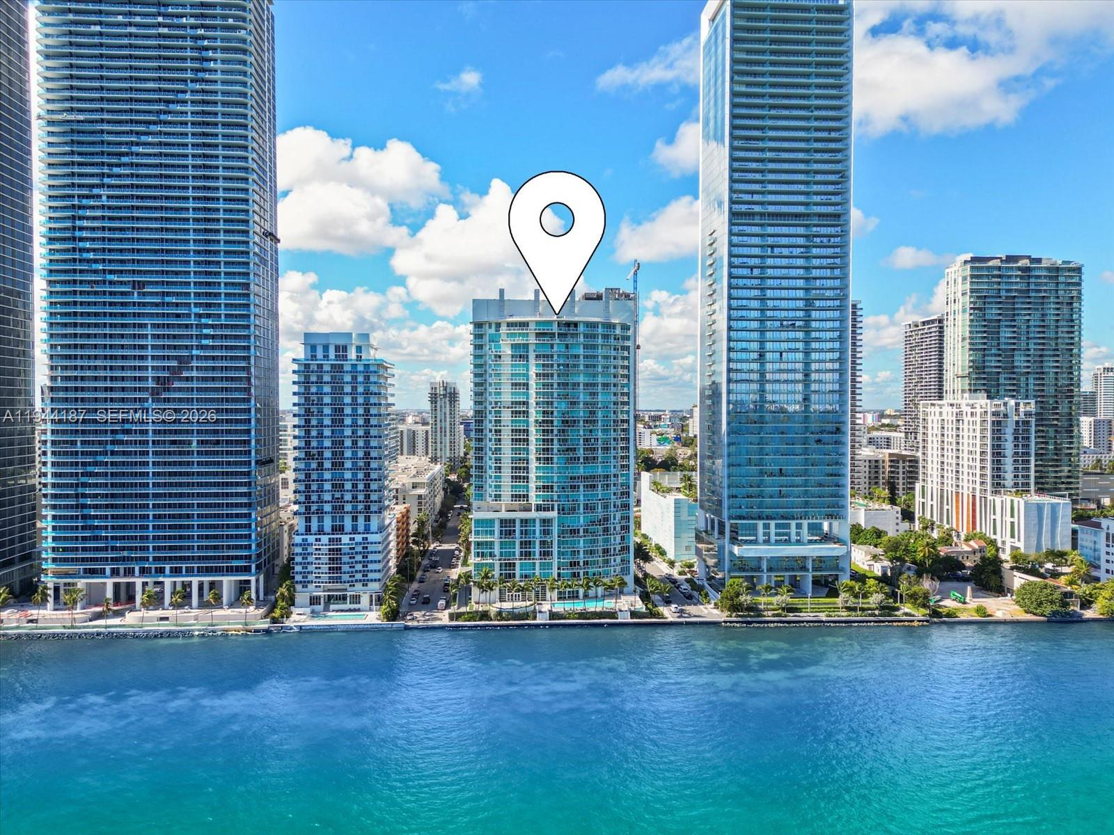665 Northeast 25th Street, Unit 1101 Miami, FL 33137 - Photo 2 of 47 a view of a house with a yard and plants
