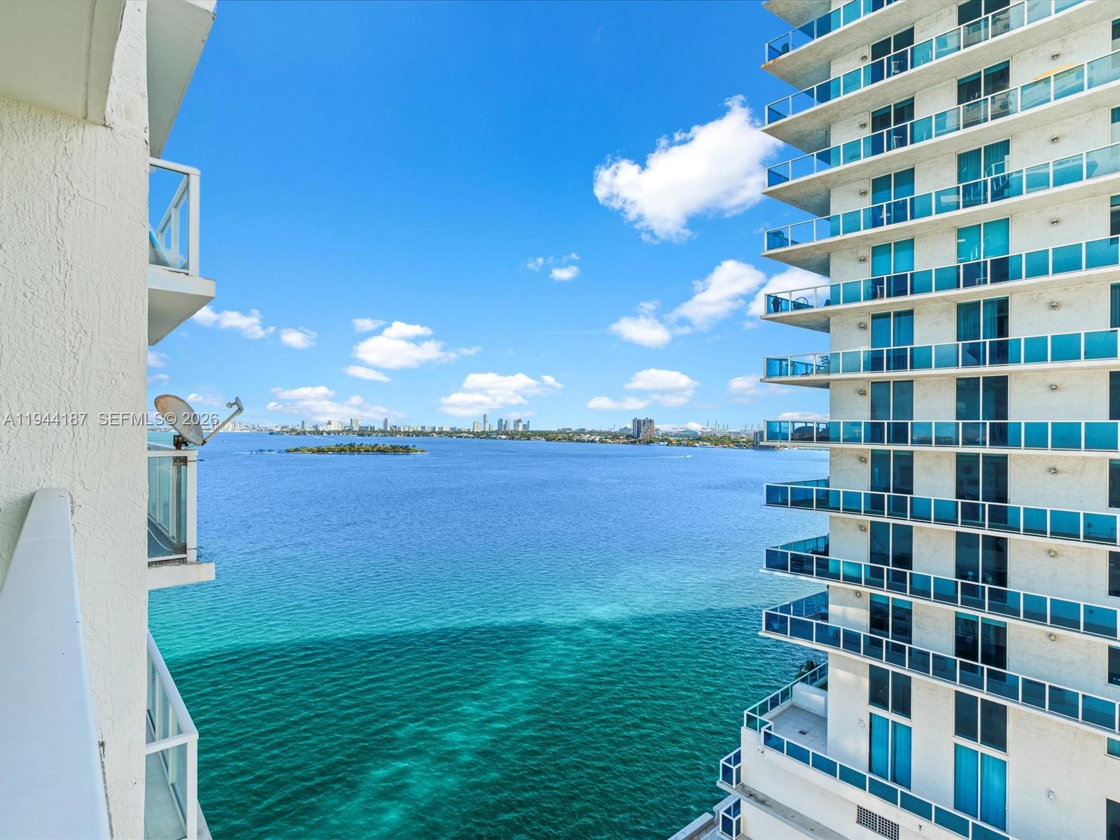 665 Northeast 25th Street, Unit 1101 Miami, FL 33137 - Photo 28 of 47 a view of a lake with big building