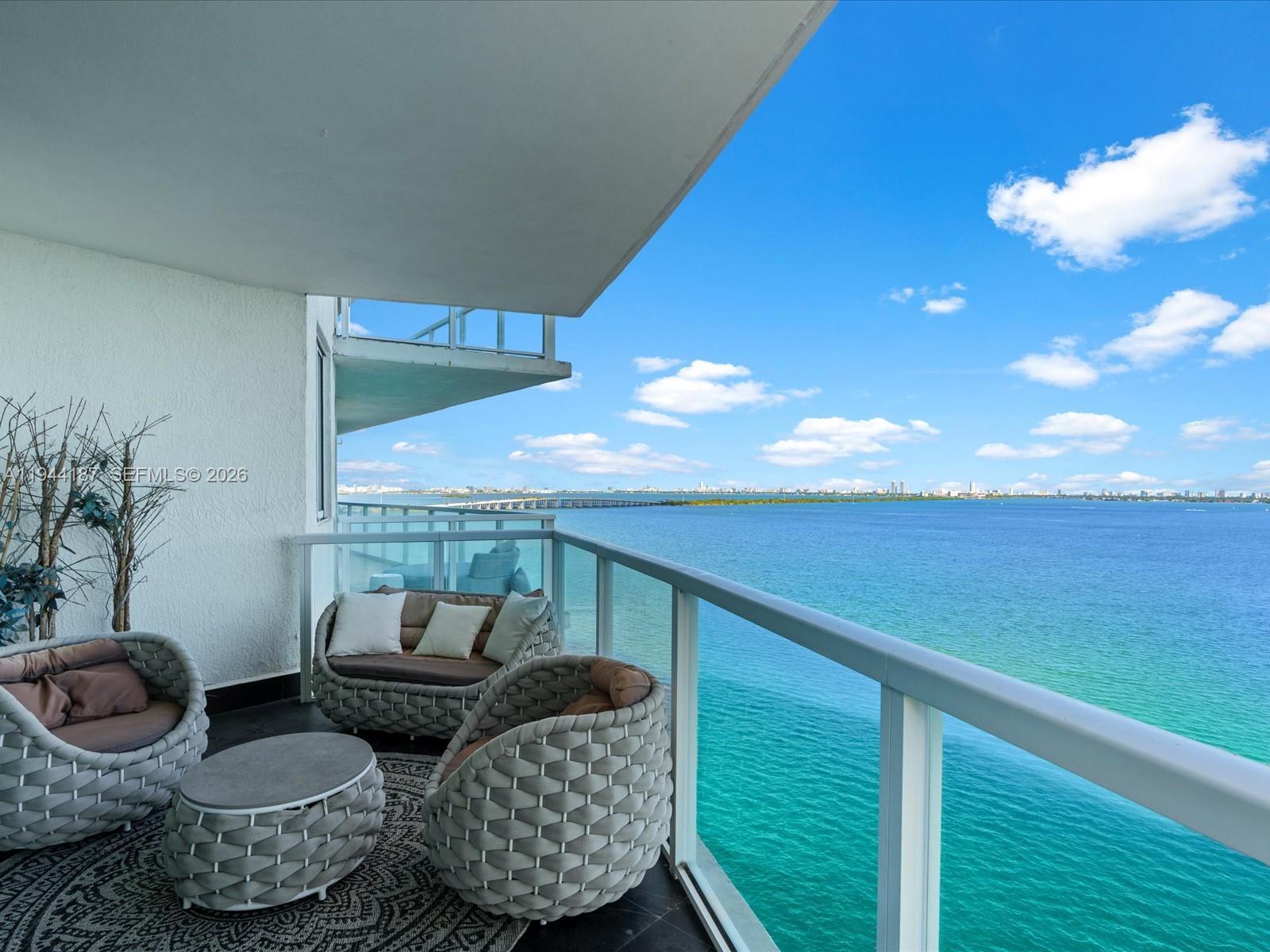 665 Northeast 25th Street, Unit 1101 Miami, FL 33137 - Photo 3 of 47 a balcony with furniture and a potted plant