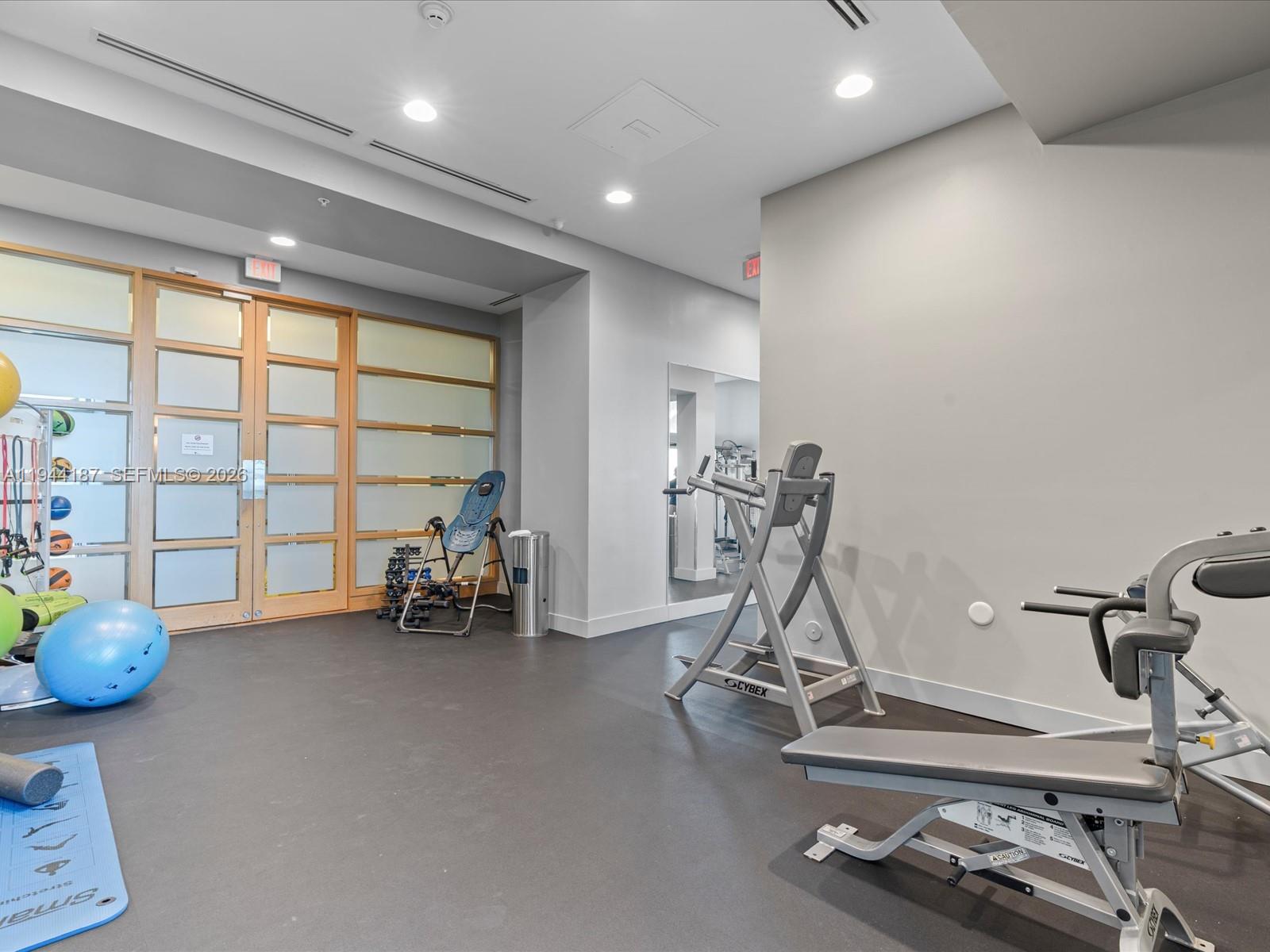 665 Northeast 25th Street, Unit 1101 Miami, FL 33137 - Photo 38 of 47 a view of a room with gym equipment