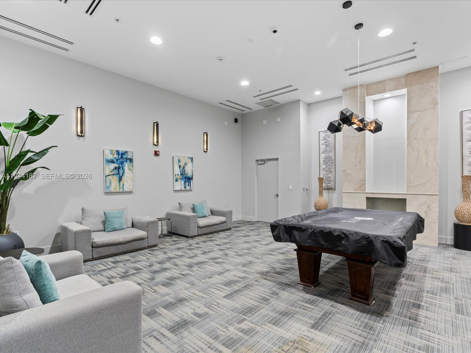 665 Northeast 25th Street, Unit 1101 Miami, FL 33137 - Photo 39 of 47 a living room with furniture and wooden floor