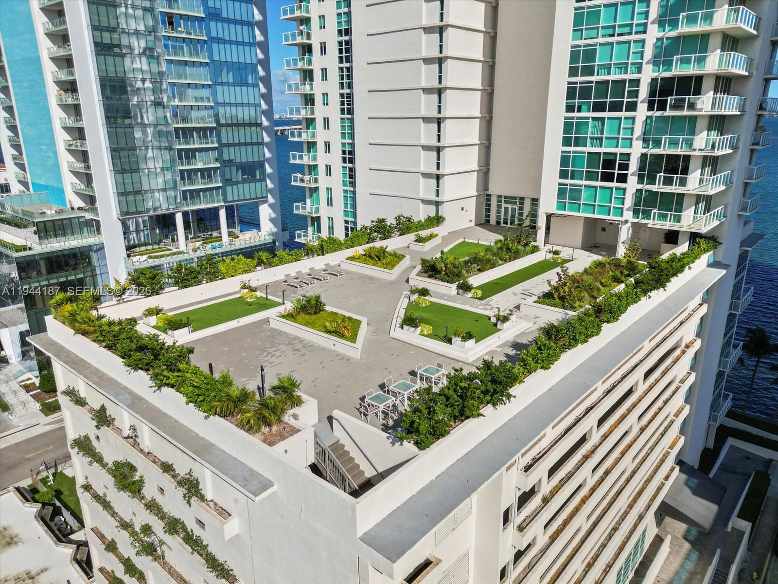 665 Northeast 25th Street, Unit 1101 Miami, FL 33137 - Photo 40 of 47 a view of swimming pool with outdoor seating