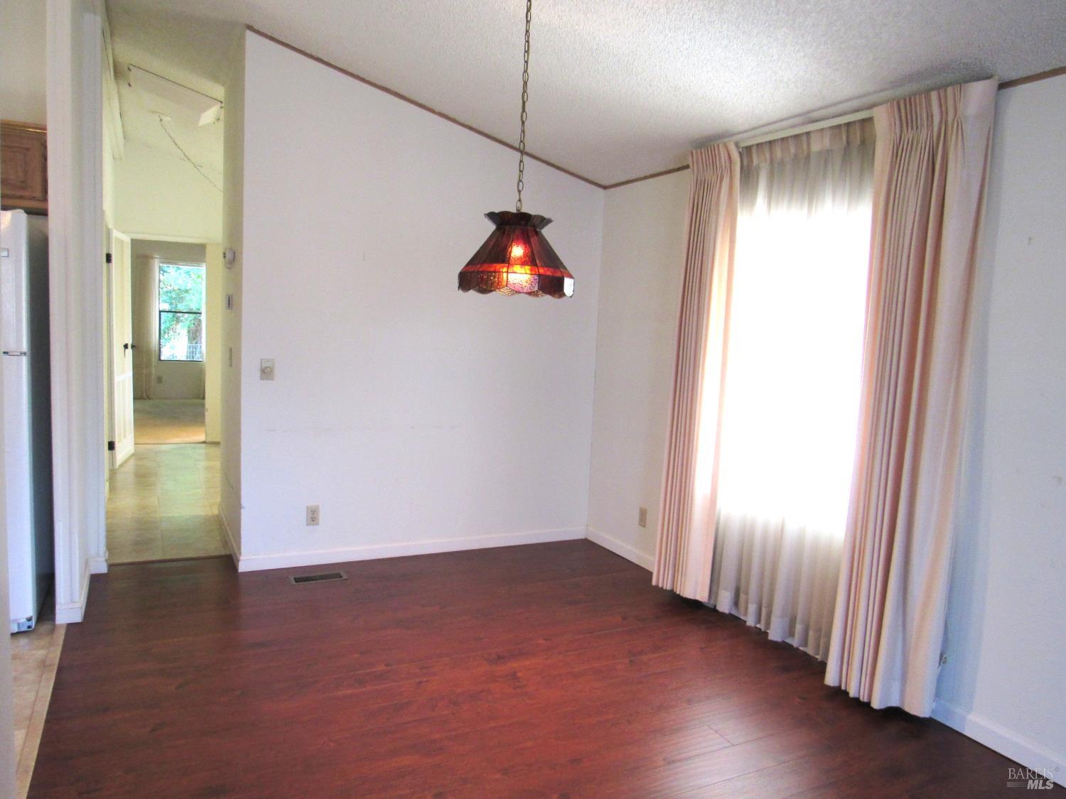 31 Ramon Street Sonoma, CA 95476 - Photo 15 of 24 an empty room with wooden floor and windows