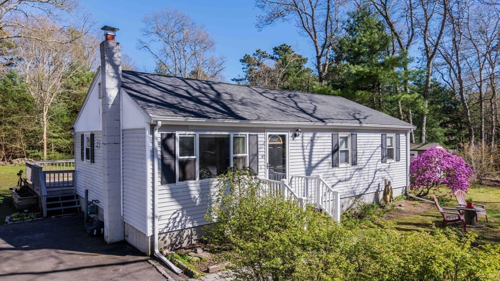 41 Standish Avenue Wareham, MA 02538 - Photo 1 of 35 a view of a house with a yard potted plants and large tree