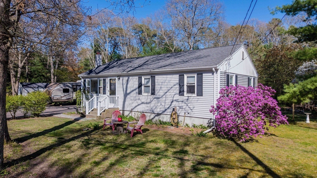 41 Standish Avenue Wareham, MA 02538 - Photo 3 of 35 a view of a house with wooden fence next to a yard
