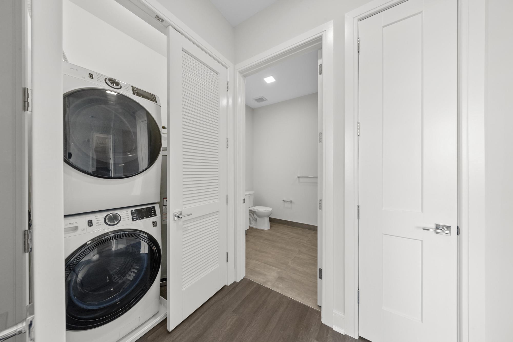 121 34th Street, Unit 401 Union City, NJ 07087 - Photo 11 of 44 a view of a hallway with washer and dryer
