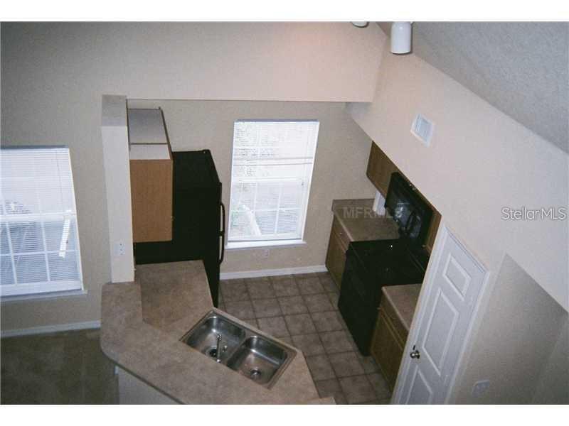 5581 Rosehill Road, Unit 203 Sarasota, FL 34233 - Photo 6 of 17 a living room with furniture and a window