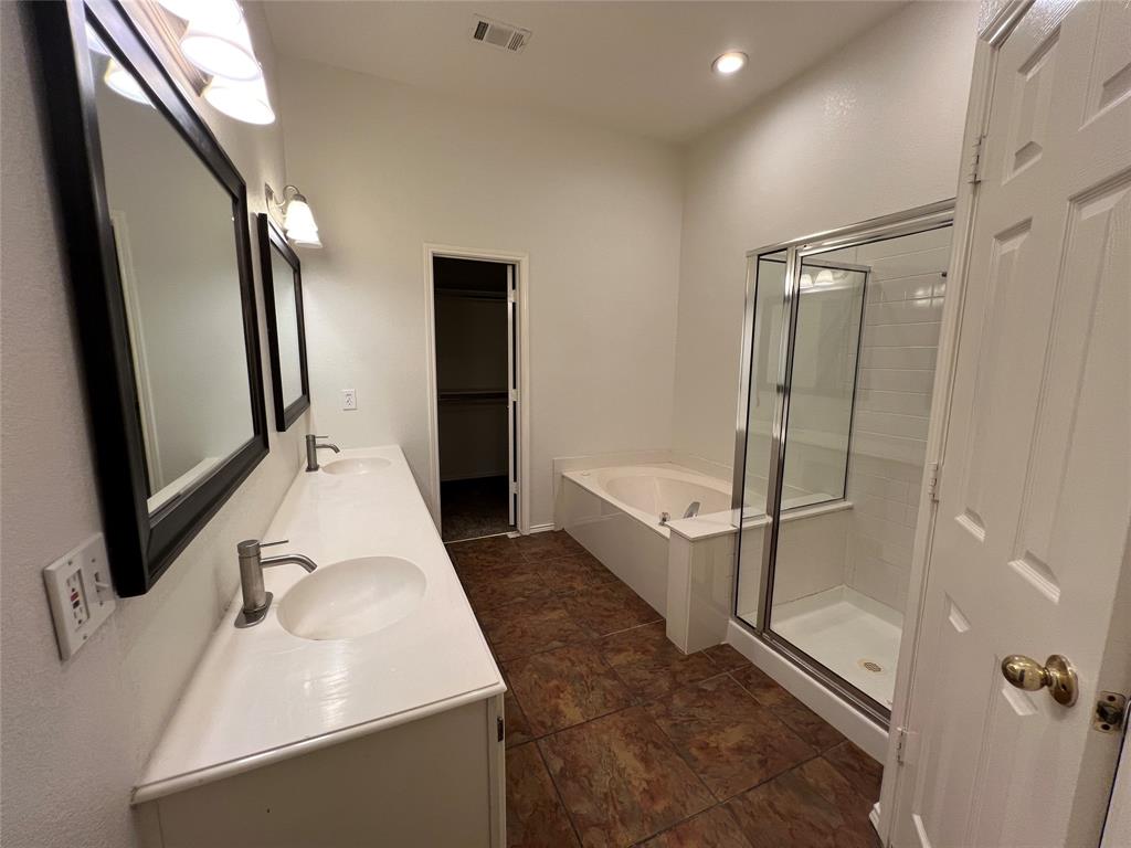 334 Touchdown Drive Irving, TX 75063 - Photo 23 of 32 Dual vanity with integrated sinks, brushed nickel faucets, and framed mirrors
