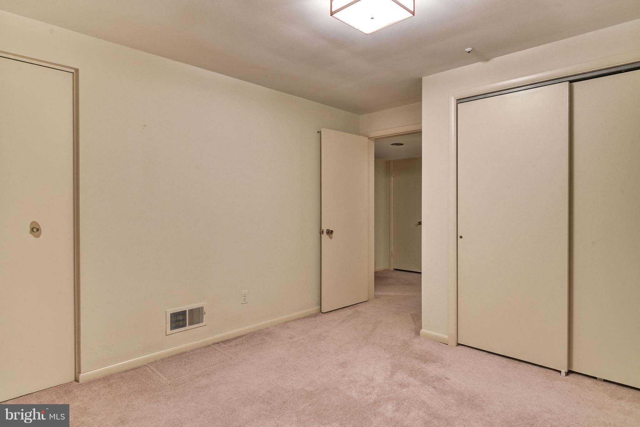 7425 Arrowood Road Bethesda, MD 20817 - Photo 21 of 25 One of the two basement bedrooms