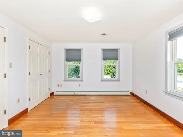 a living room with furniture or couch and a large window