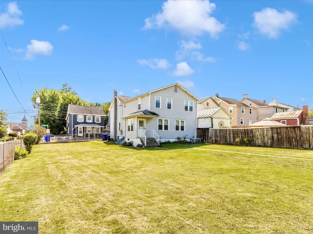 a view of house with outdoor space and swimming pool