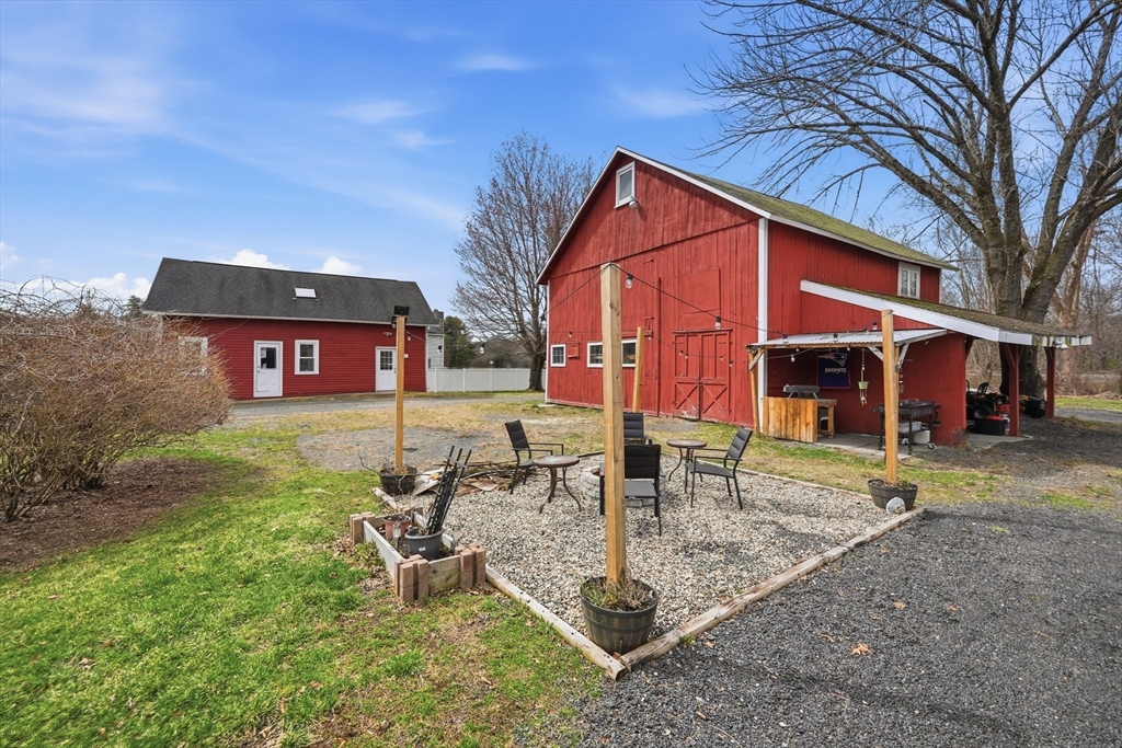 79 State Road Whately, MA 01373 - Photo 31 of 40 a front view of a house with garden