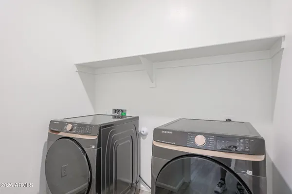 a utility room with dryer and washer