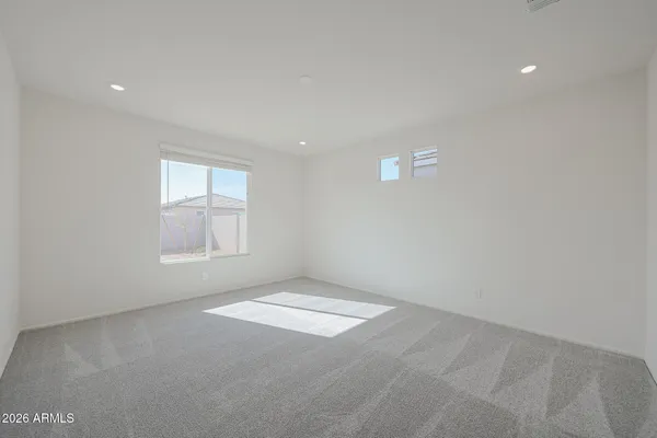 an empty room with a empty space and windows