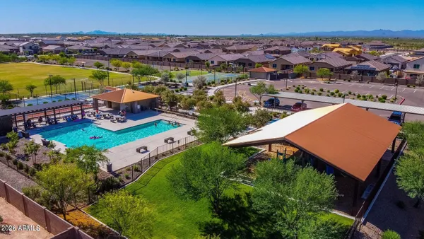 an aerial view of residential houses with outdoor space