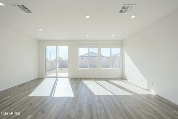 a view of an empty room and glass door