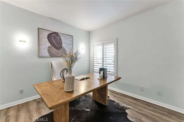 a view of a room with a table and chairs