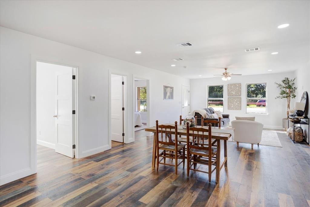 402 West Sam Rayburn Drive Ector, TX 75439 - Photo 17 of 40 a view of a dining room with furniture and wooden floor