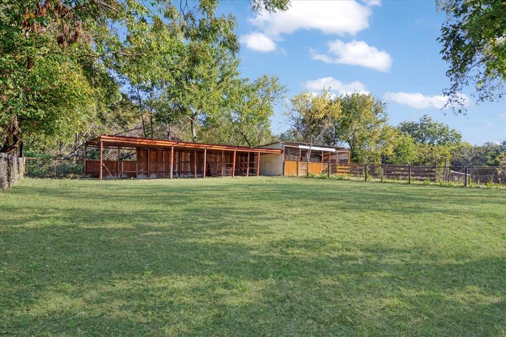 402 West Sam Rayburn Drive Ector, TX 75439 - Photo 37 of 40 a house view with a garden space