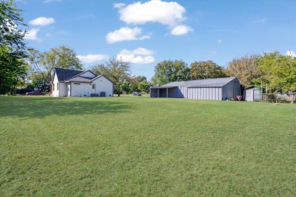 402 West Sam Rayburn Drive Ector, TX 75439 - Photo 40 of 40 a view of a house with a yard