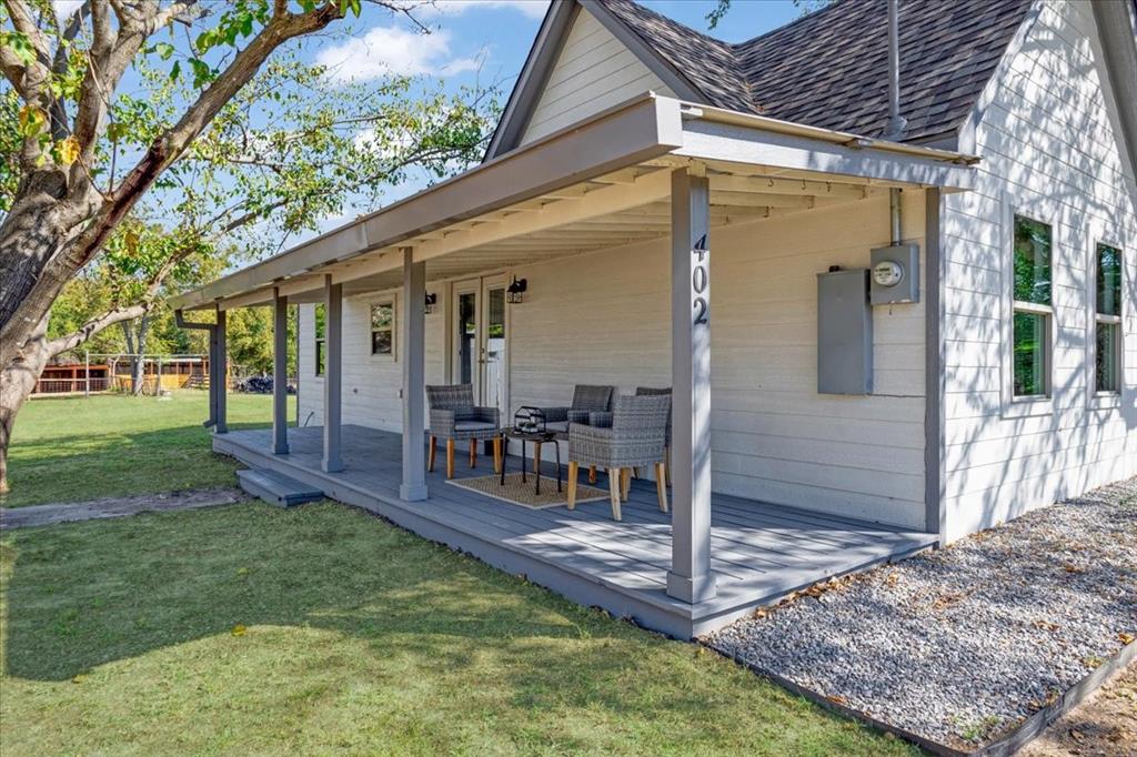 402 West Sam Rayburn Drive Ector, TX 75439 - Photo 5 of 40 a view of a house with backyard porch and sitting area
