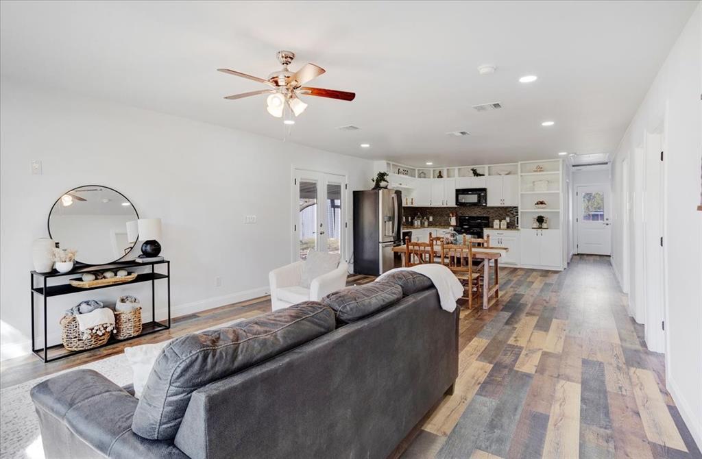 402 West Sam Rayburn Drive Ector, TX 75439 - Photo 6 of 40 a living room with furniture and kitchen view