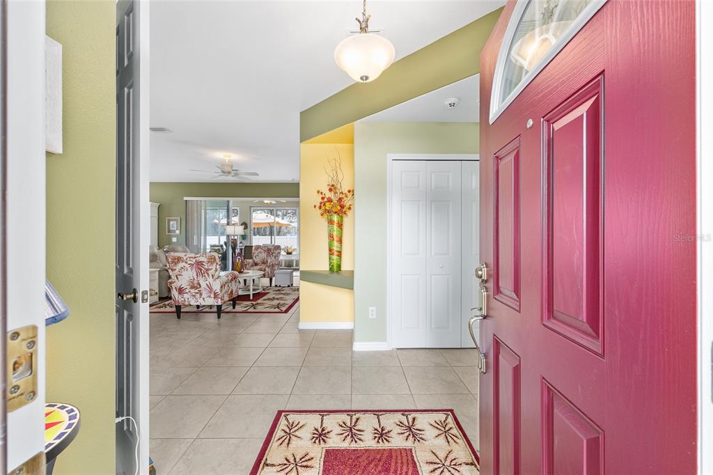 16339 Southwest 14th Avenue Road Ocala, FL 34473 - Photo 6 of 22 a hallway with a dining table and chairs