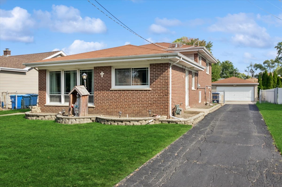 a front view of a house with a yard and porch
