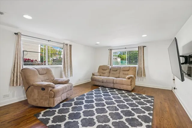 a living room with furniture and a rug