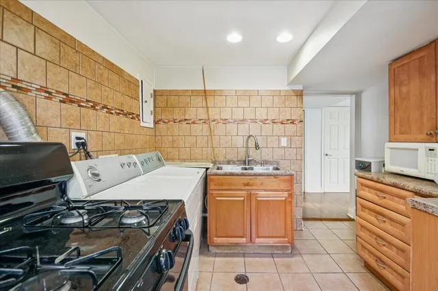 a kitchen with a stove and a sink