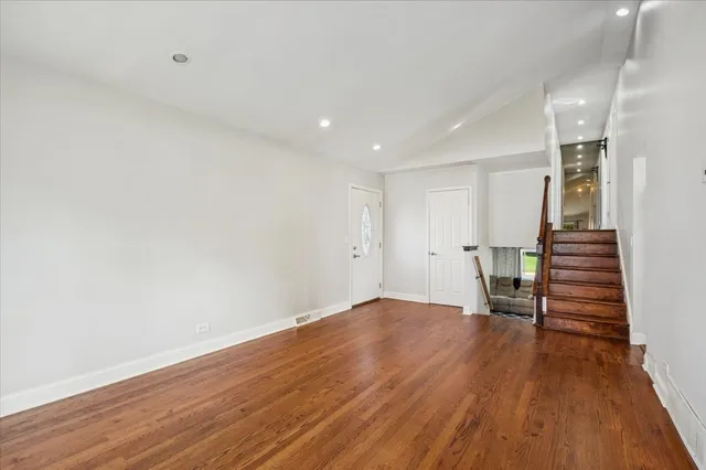 a view of wooden floor and stairs in a room