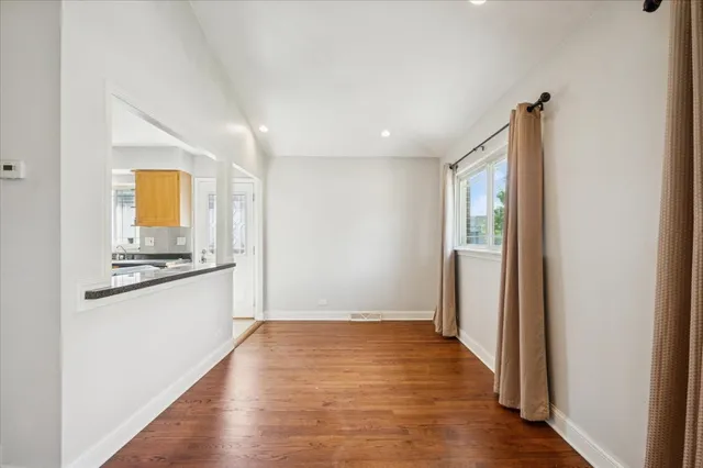 a view of a kitchen cabinets and wooden floor