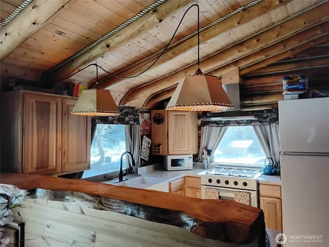 a living room with furniture and wooden floors