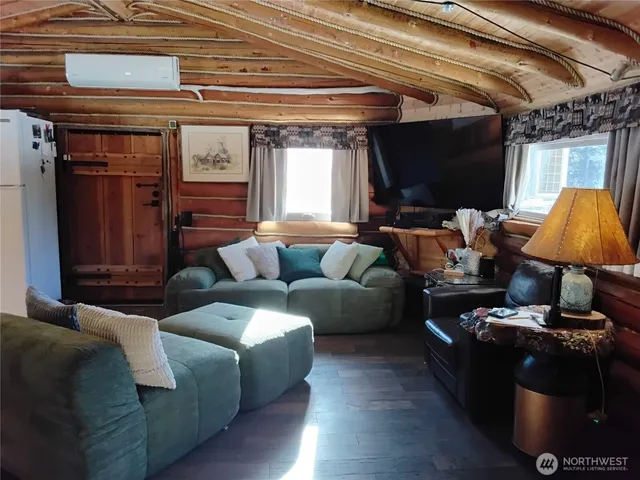 a living room with furniture and a window