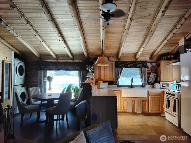 a kitchen with stainless steel appliances granite countertop a sink and a stove