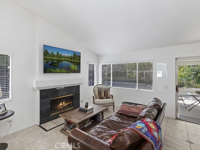 a bedroom with furniture and a fireplace