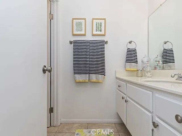 a bathroom with a sink a mirror and a shower
