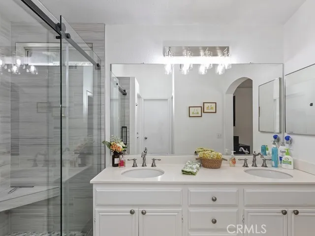 a bathroom with a sink and a mirror