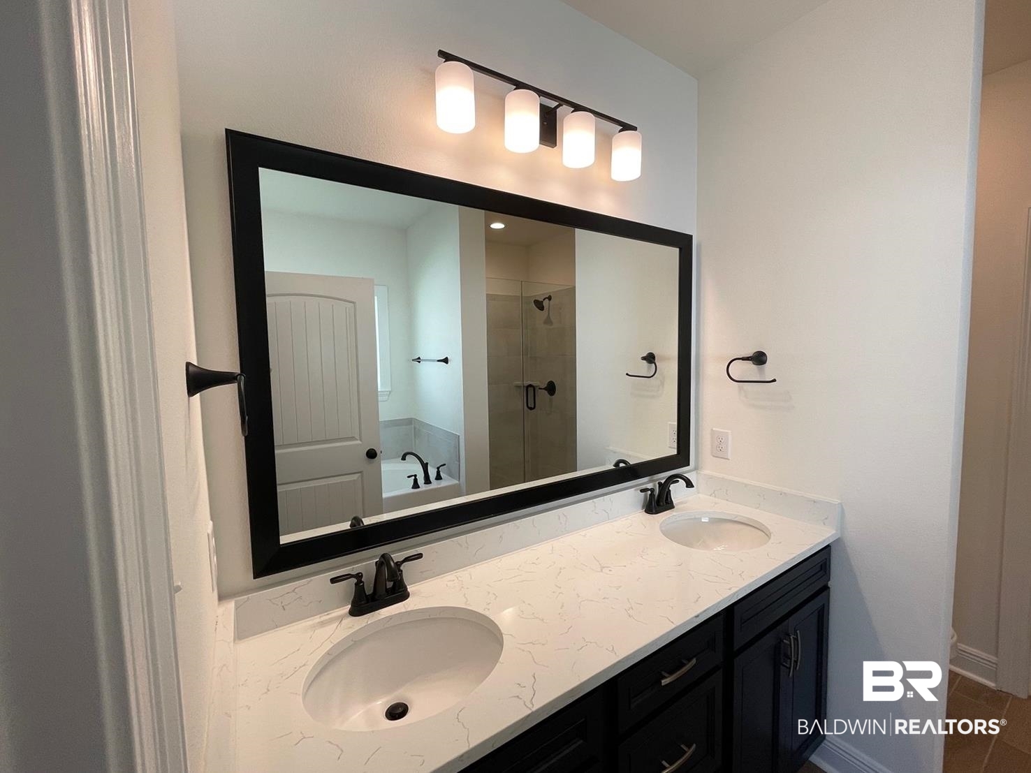 1565 Fenton Circle Foley, AL 36535 - Photo 6 of 15 Bathroom featuring vanity, plus walk in shower, and tile patterned floors