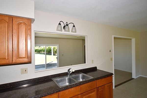17-239 Volcano Road Keaau, HI 96749 - Photo 11 of 25 a bathroom with a sink and a window